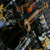<p>Gorgeous solid top electro by Lag.&nbsp; Black high gloss finish.</p>