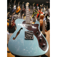 Gorgeous thinline telecaster with short scale neck, metallic blue finish, cream binding on body and neck, humbucking neck pickup, ash body, and more.