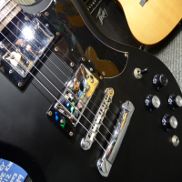<p>Entry-level SG copy with bolt-on neck.</p><p>Condition: Neck pocket cracks in the finish, and missing cap on one of the volume knobs, nothing major.</p>