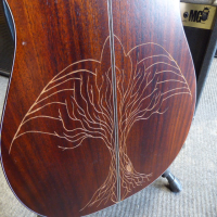 <p>Lovely small-bodied all-solid mahogany acoustic by Ibanez.</p><p>Condition: There is some artwork scraped into the back and a couple of small chips in the table, otherwise very good.</p>