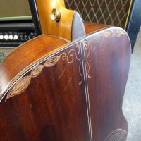 <p>Lovely small-bodied all-solid mahogany acoustic by Ibanez.</p><p>Condition: There is some artwork scraped into the back and a couple of small chips in the table, otherwise very good.</p>