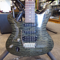 <p>Lovely HSS guitar with quilted maple top and transparent grey finish.&nbsp; Made in Korea (2003/04).</p><p>Condition: A couple of small dents and various pick scrapes and belt-buckle scrapes.</p>